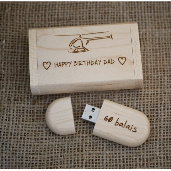 Engraving of a helicopter on a light wood USB key