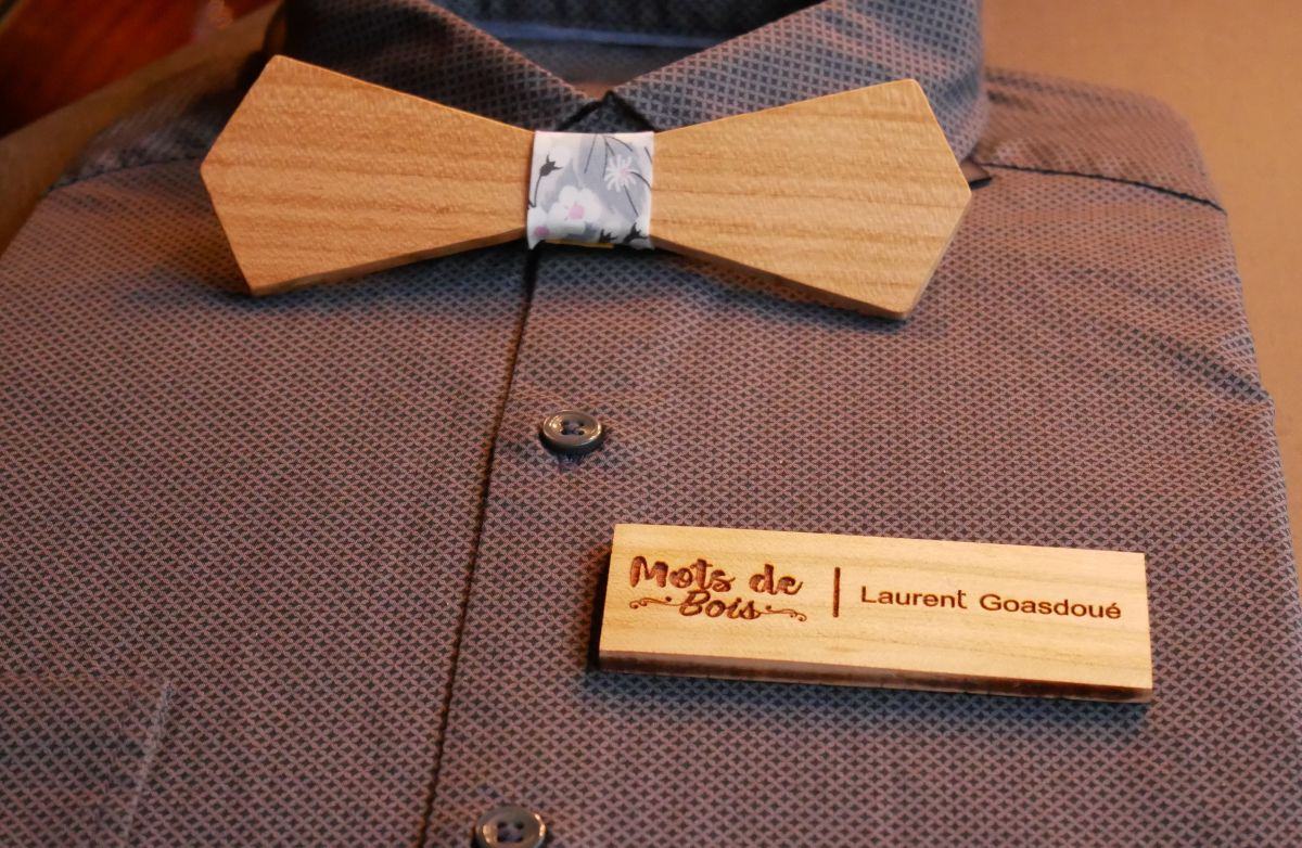 Wooden badge with company logo and name