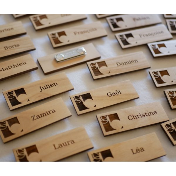 Wooden badge with company logo and name