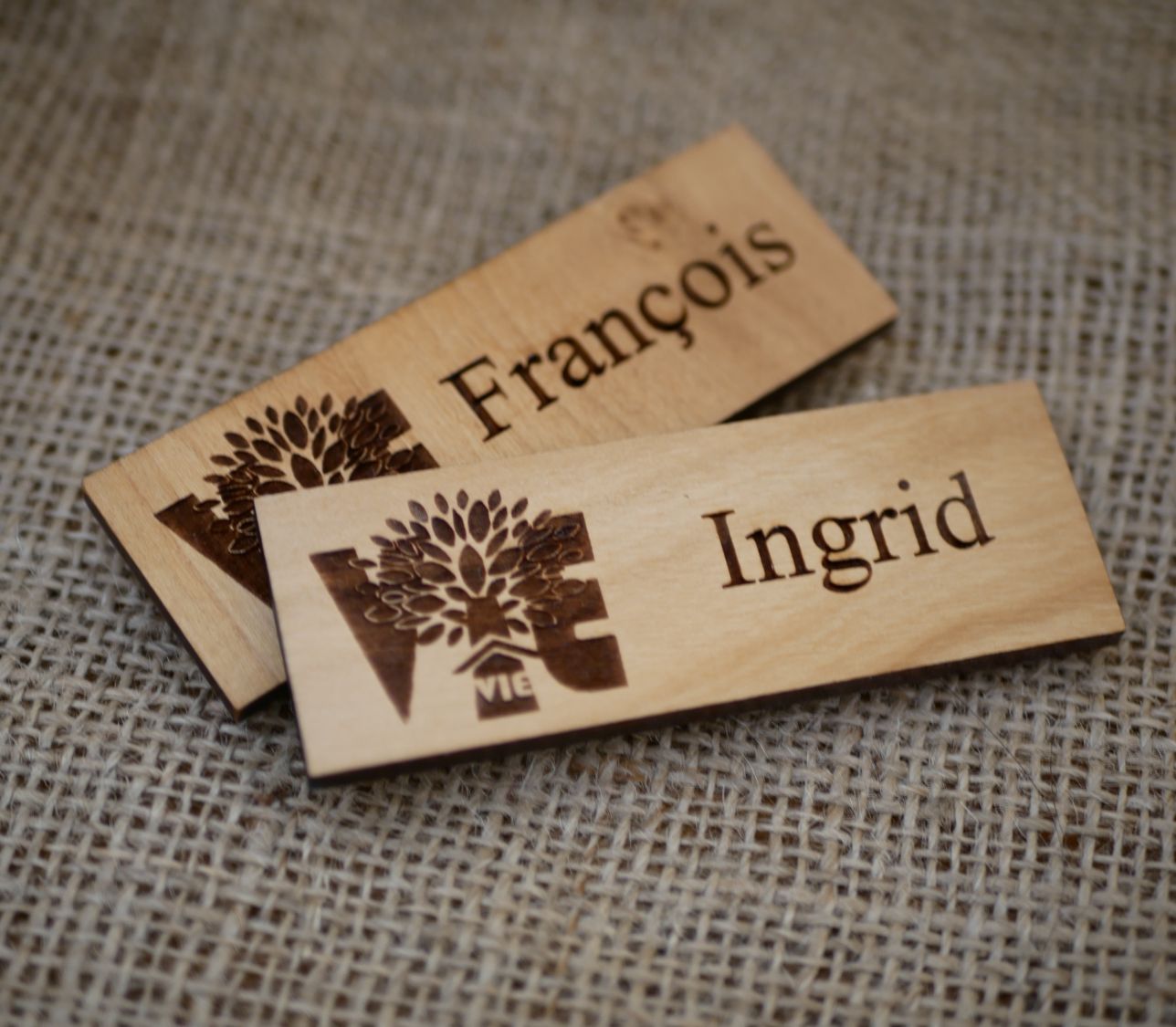 Wooden badge with company logo and name