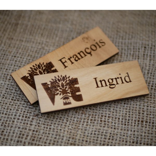 Wooden badge with company logo and name