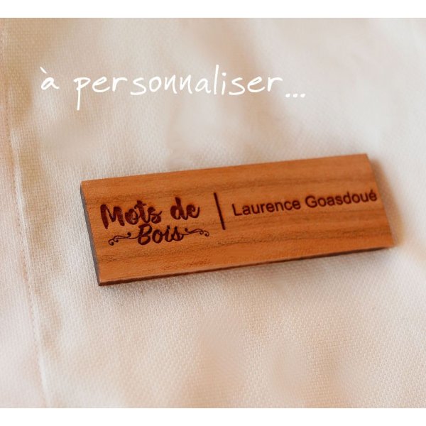 Wooden badge with company logo and name