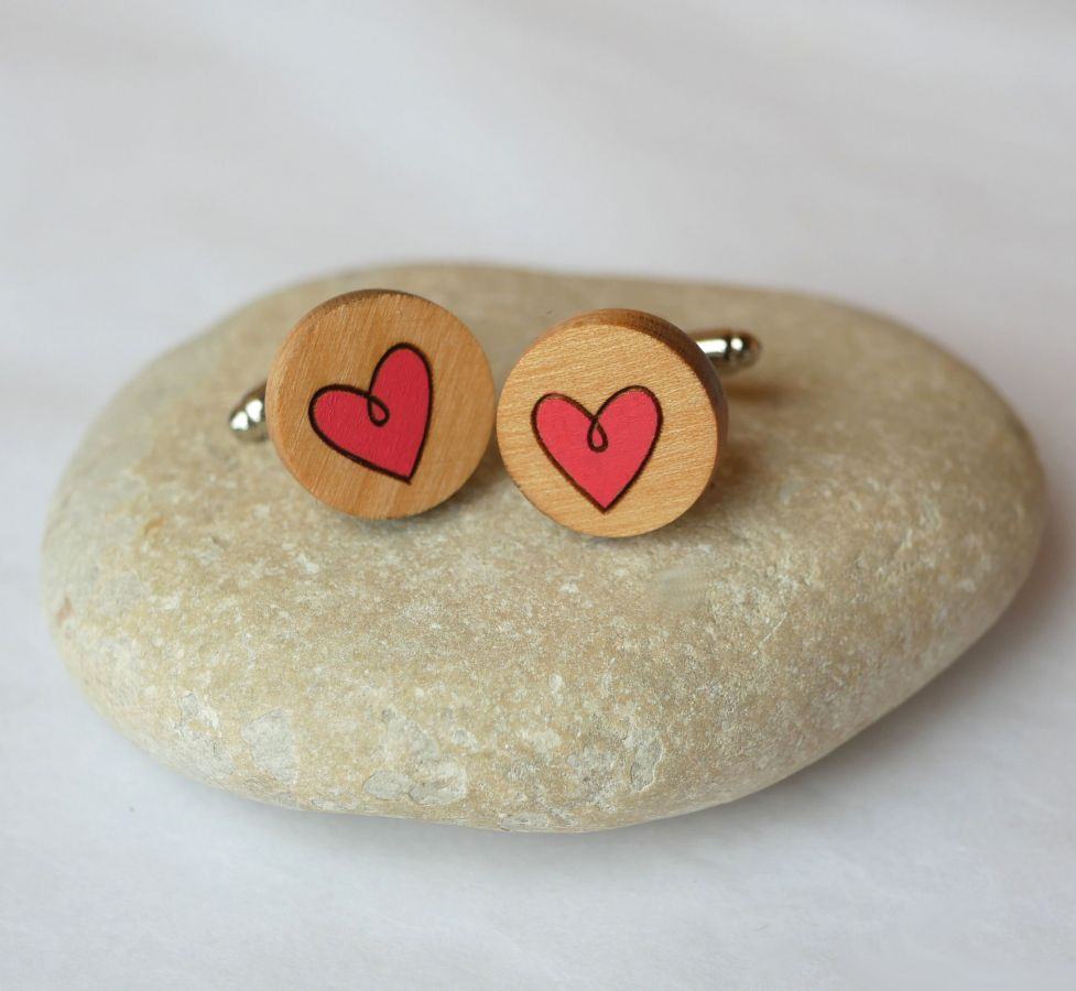 Wooden cufflinks with painted hearts