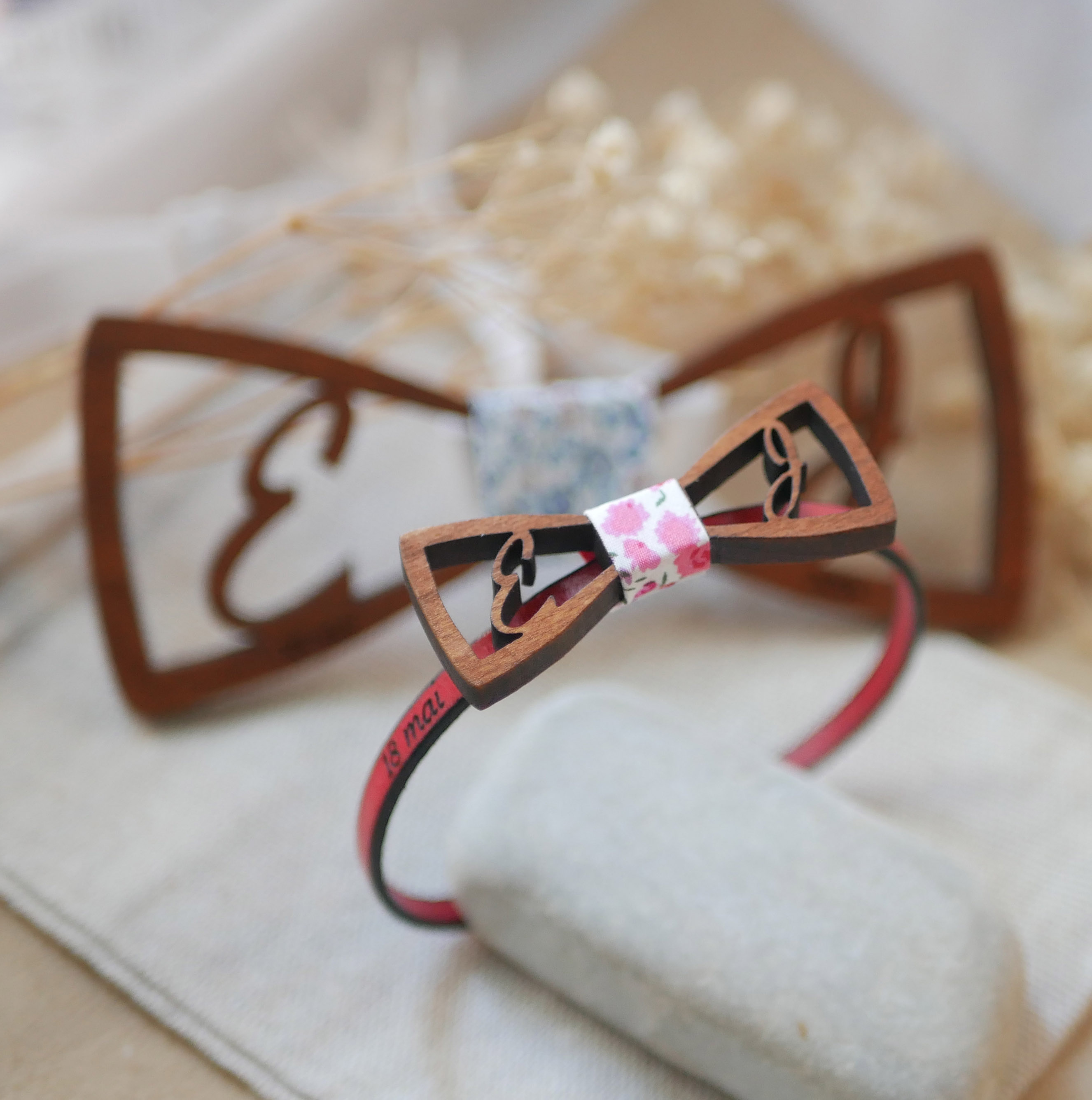 Leather bracelet with miniature wooden bow tie and openwork initials