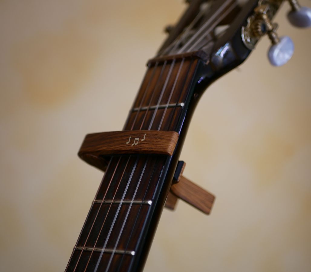 Aluminum guitar capo with gold engraving to personalize