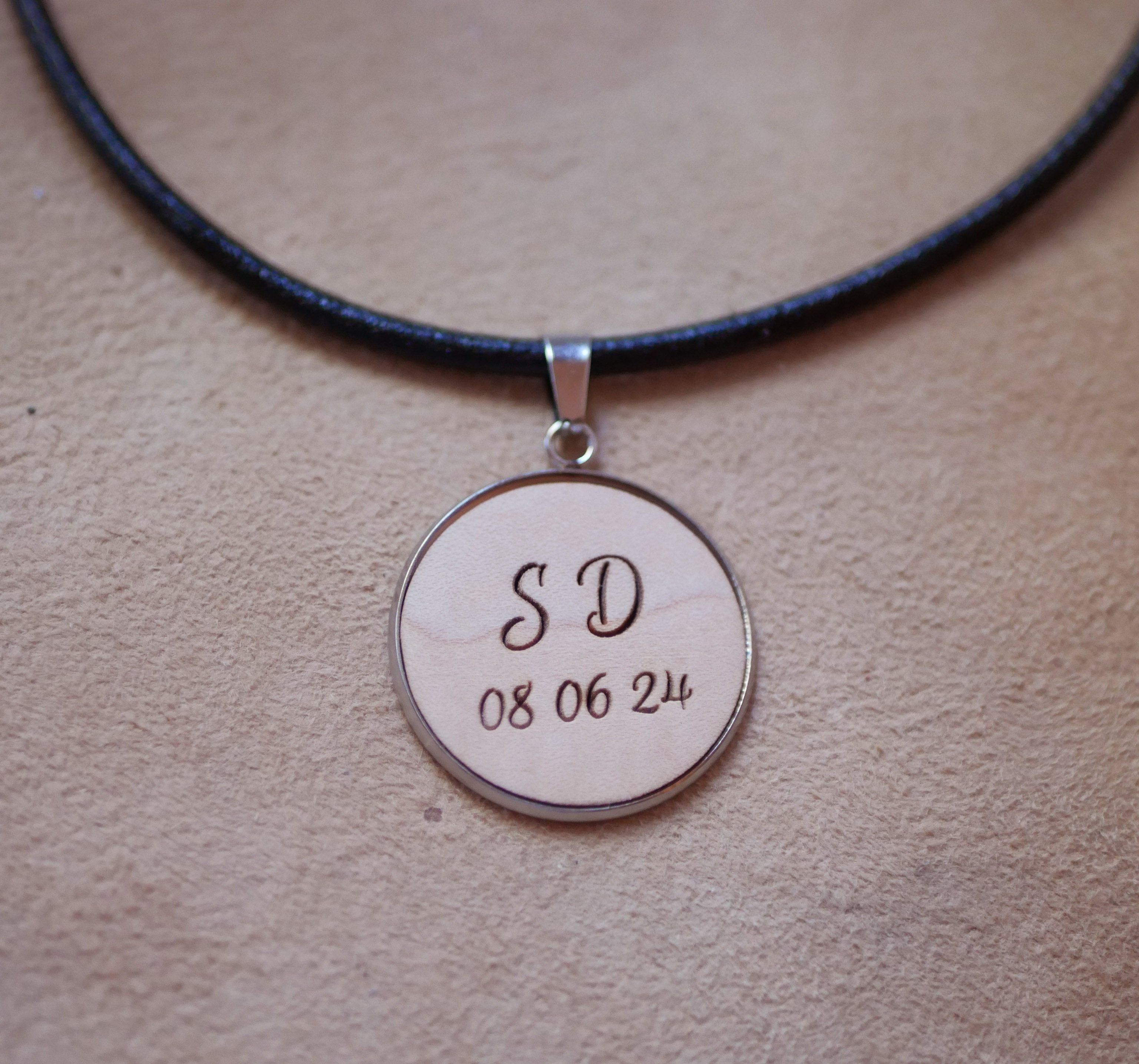 Engraved wooden medallion on European leather necklace to personalize 