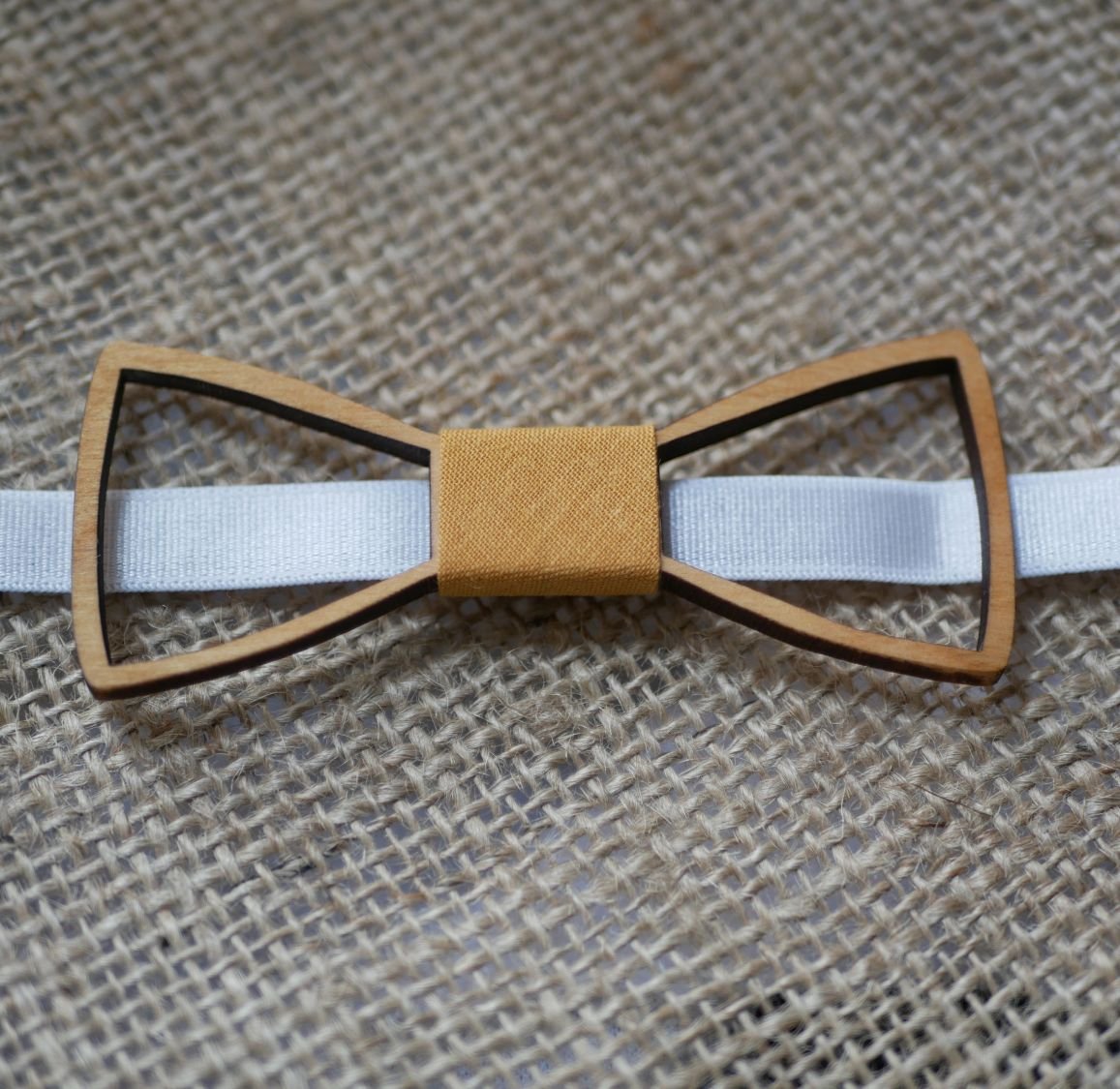 Mini wooden bow tie with hollowed out arasbesques 