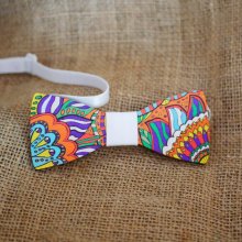 Painted wooden bow tie with floral design, a unique handmade creation